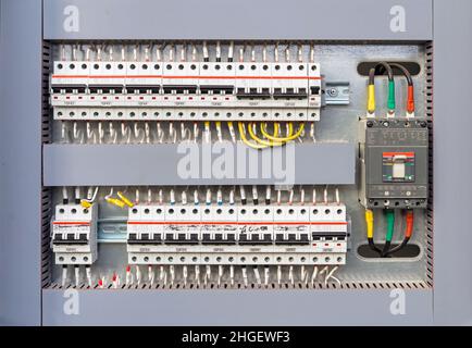 Electrical switchboard with different colored wires and sensors. Electricity equipment. Stock Photo