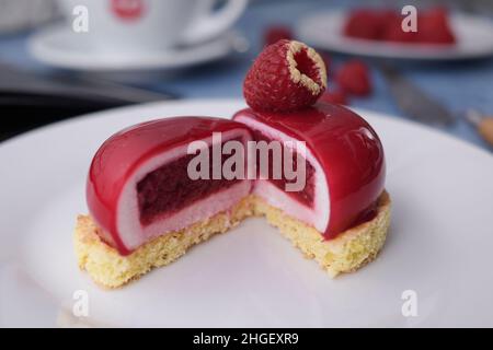 Red dessert on a biscuit, raspberry diet dessert in a cut. Stock Photo