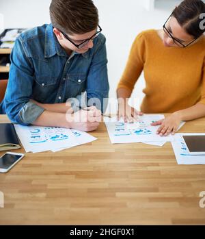 Collaborating on a new design. Shot of two colleagues working together on a creative project. Stock Photo