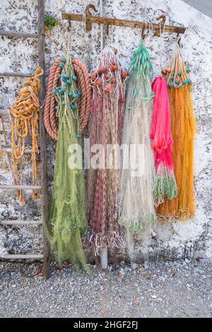 Old fishing nets hanging on wooden brown wall Stock Photo - Alamy