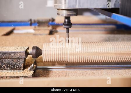 Wood carving machine. Modern automatic woodworking machine with CNC. Furniture production. Stock Photo