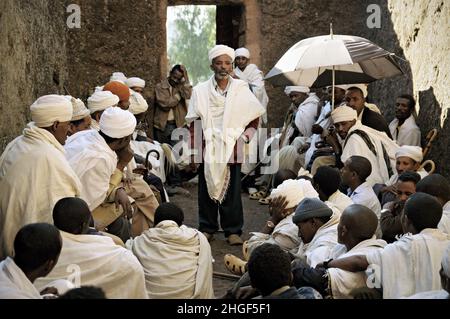 Priests meeting in a cavity at Lalibela, Amhara Region, Ethiopia Stock Photo