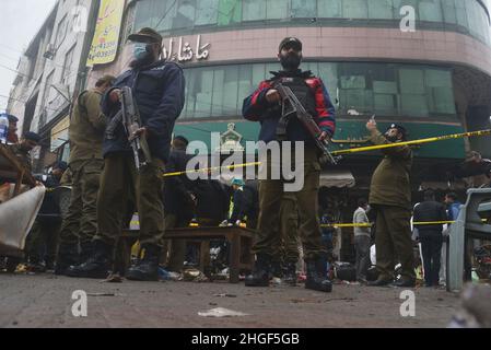 Lahore, Punjab, Pakistan. 20th Jan, 2022. Pakistani investigators gather evidence as they examine the site of a bomb explosion in Lahore. Police said the powerful bomb exploded in a crowded Anarkali bazar in Pakistan's second largest city of Lahore at least four people were killed and 28 injured in a blast officials said. (Credit Image: © Rana Sajid Hussain/Pacific Press via ZUMA Press Wire) Stock Photo