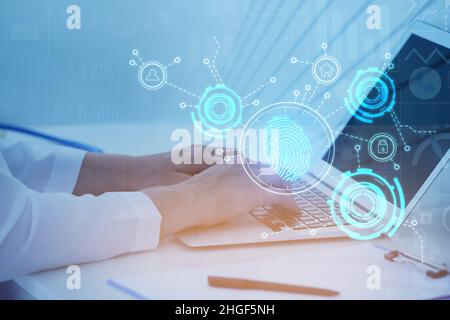 Young businesswoman logging into electronic personal account in office Stock Photo