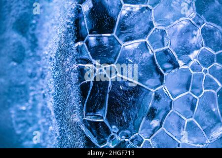 closeup of ice with colourful backlight for design purpose, textured background Stock Photo