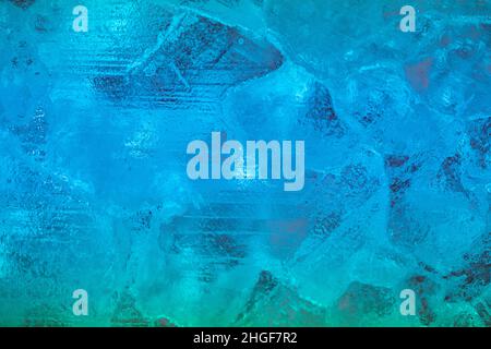 closeup of ice with colourful backlight for design purpose, textured background Stock Photo