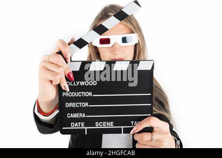 Leisure concept. Brunette young and attractive woman with 3D glasses holding black movie making clapperboard with copy space and isolated on white bac Stock Photo
