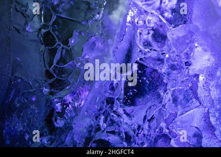 closeup of ice with colourful backlight for design purpose, textured background Stock Photo