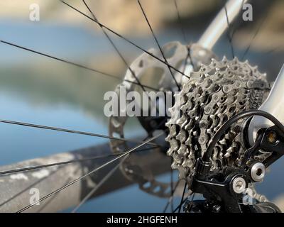 Close-up view of the gears and chains on a bicycle wheel. Stock Photo