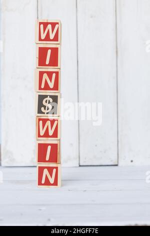 wooden cube, with with word win, on white background