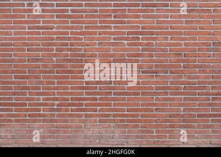 Old brown bricks dirty wall background with some imperfections Stock Photo