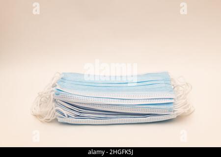 A pile of generic disposable medical masks to protect against diseases, such as flu and viruses, coronavirus Stock Photo