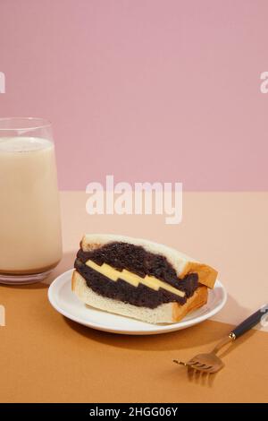 korean traditional dessert, red bean butter bread, latte Stock Photo