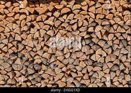 background of stacked firewood, woodpile Stock Photo