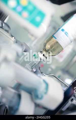 IV drip and perfusion devices in the hospital room. Stock Photo