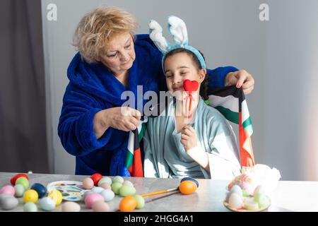 grandmother and granddaughter with uae flag for easter Stock Photo
