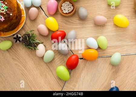 Easter cake and colorful eggs on festive Easter table Stock Photo