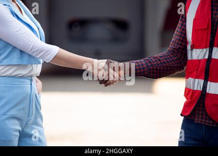 The manager greets the foreman. Shake hands Stock Photo