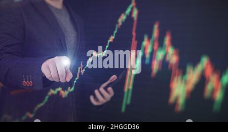 Stock market, Business growth, progress or success concept. Hand of Businessman or trader is showing a growing virtual hologram stock on smartphone Stock Photo