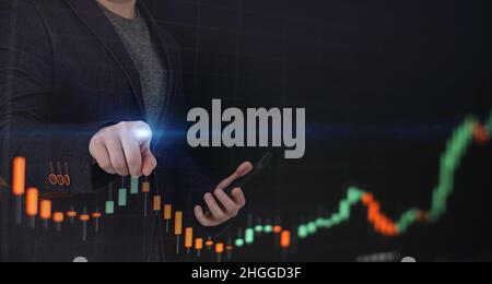 Stock market, Business growth, progress or success concept. Hand of Businessman or trader is showing a growing virtual hologram stock on smartphone Stock Photo