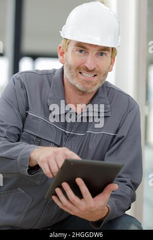 building entrepreneur using digital tablet on site Stock Photo