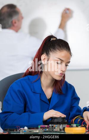 young woman using a multimeter Stock Photo
