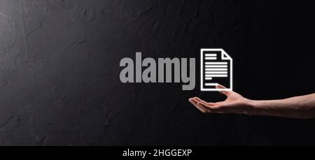 Hand holding a document icon in his hand Document Management Data System Business Internet Technology Concept. Corporate data management system DMS. Stock Photo
