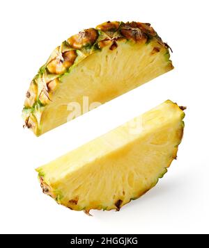 Flying pineapple slices isolated on white, food levitation Stock Photo