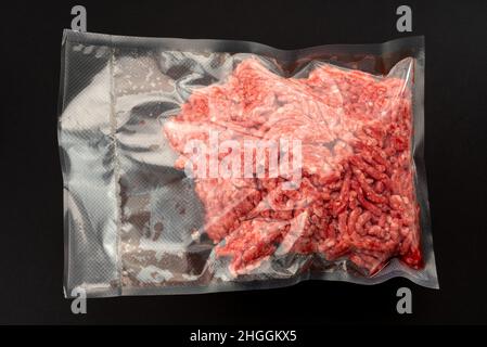 Minced beef in vacuum packed sealed for sous vide cooking on nero background Stock Photo