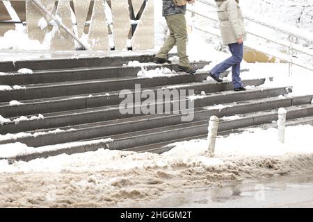 Snowy and icy stairs in front marketplace amd public place Stock Photo