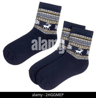 Pair of blue Nordic style socks with Norwegian knitted pattern isolated on a white background Stock Photo