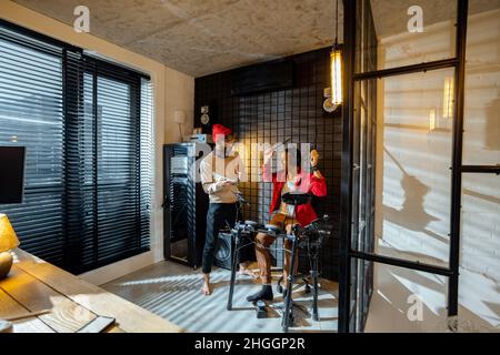 Men playing electric drums at home sstudio Stock Photo