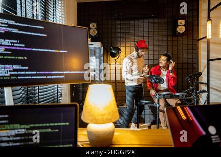 Men playing electric drums at home sstudio Stock Photo