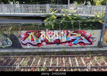 graffiti next railtracks, Germany, North Rhine-Westphalia, Cologne Stock Photo
