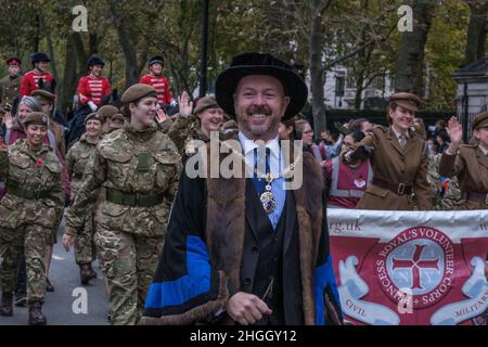 Smiling man in ceremonial robes marching with The First Aid Nursing Yeomanry at the Lord Mayor's Show 2021, Victoria Embankment, London, UK. Stock Photo