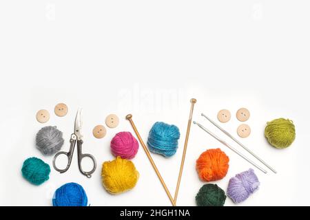 Dark green thread spool with purple crochet hook, isolated on white  background Stock Photo - Alamy