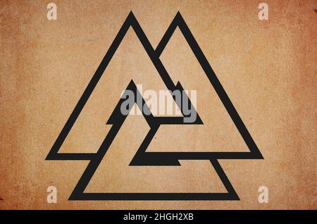 Valknut amulet ancient strong scandinavian and celtic mythical rune on grunge background Stock Photo