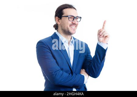 Confident businessman pointing up forefinger smiling isolated on white background. Contented business person, wearing eyeglasses, determined shows ind Stock Photo