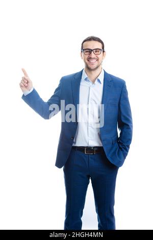 Confident businessman pointing up forefinger smiling isolated on white background. Contented business person, wearing eyeglasses, determined shows ind Stock Photo
