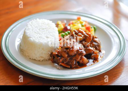 stewed pork ,pork with rice and sauce or rice with stew pork and vegetable Stock Photo