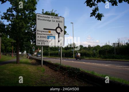 Main road direction signs on the approach to Romsey, Hampshire from Southampton Road including directions to M27 and Salisbury. Stock Photo
