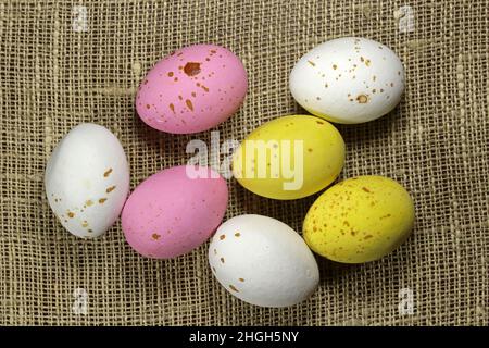 Multicolored Easter eggs on the linen fabric . Stock Photo