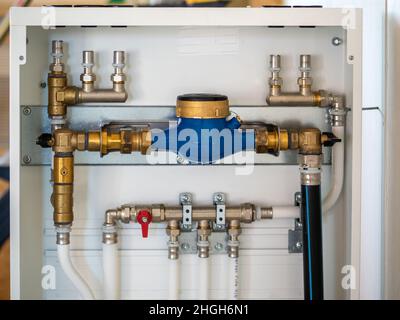 Image of Distributor of central heating. Warm floor heating pump and pipes Stock Photo