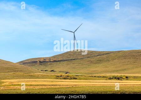 Wind turbines on top of the mountain.mountain scenery in autumn. Stock Photo