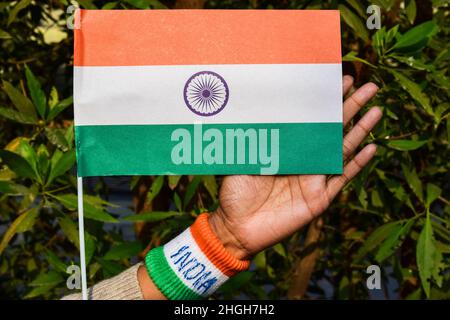 Flag of India on Republic day parade and Independence day celebration by Indian with national tricolour tiranga and wristband written India Stock Photo
