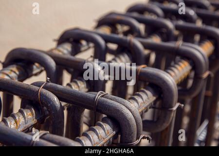 Assembly of reinforcing bars for pouring concrete. Industrial background. Rebar texture Steel rebar for reinforcement concrete at construction site. Stock Photo