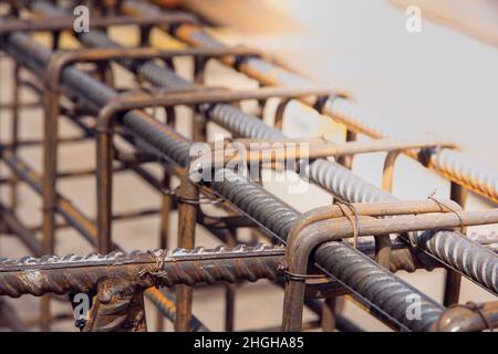 Assembly of reinforcing bars for pouring concrete. Industrial background. Rebar texture Steel rebar for reinforcement concrete at construction site. Stock Photo