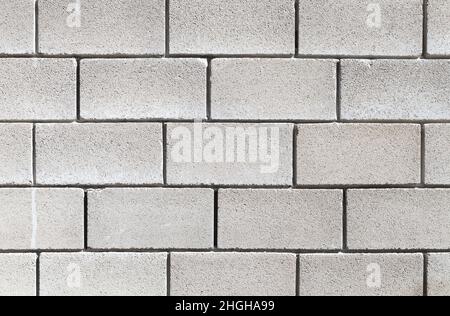 A wall made of gray foam concrete blocks, background photo texture Stock Photo