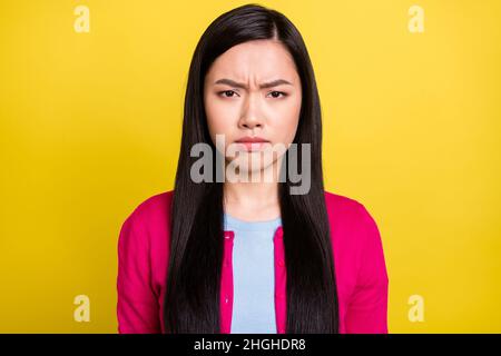 Photo of sad brunette hair millennial lady wear pink sweater isolated on yellow color background Stock Photo
