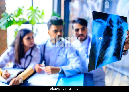 indian doctors are checking examining chest x-ray film Stock Photo